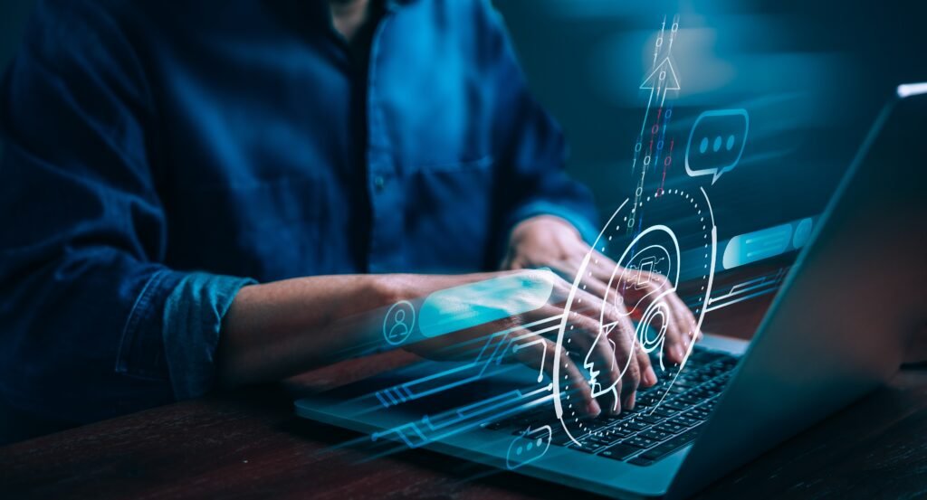 Person typing on a computer providing support