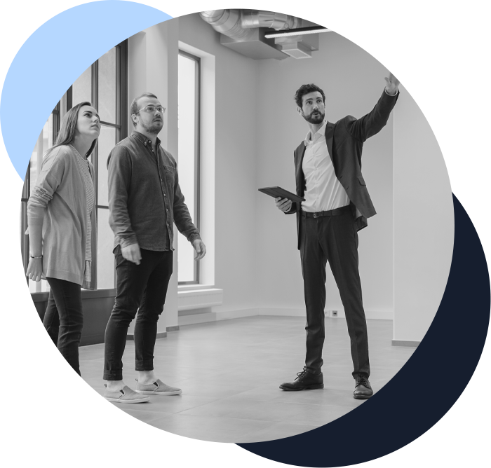 commercial real estate agent showing a space to a couple