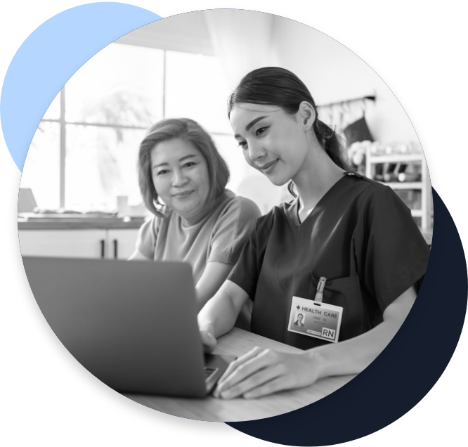 home health nurse helping a patient look something up on a laptop