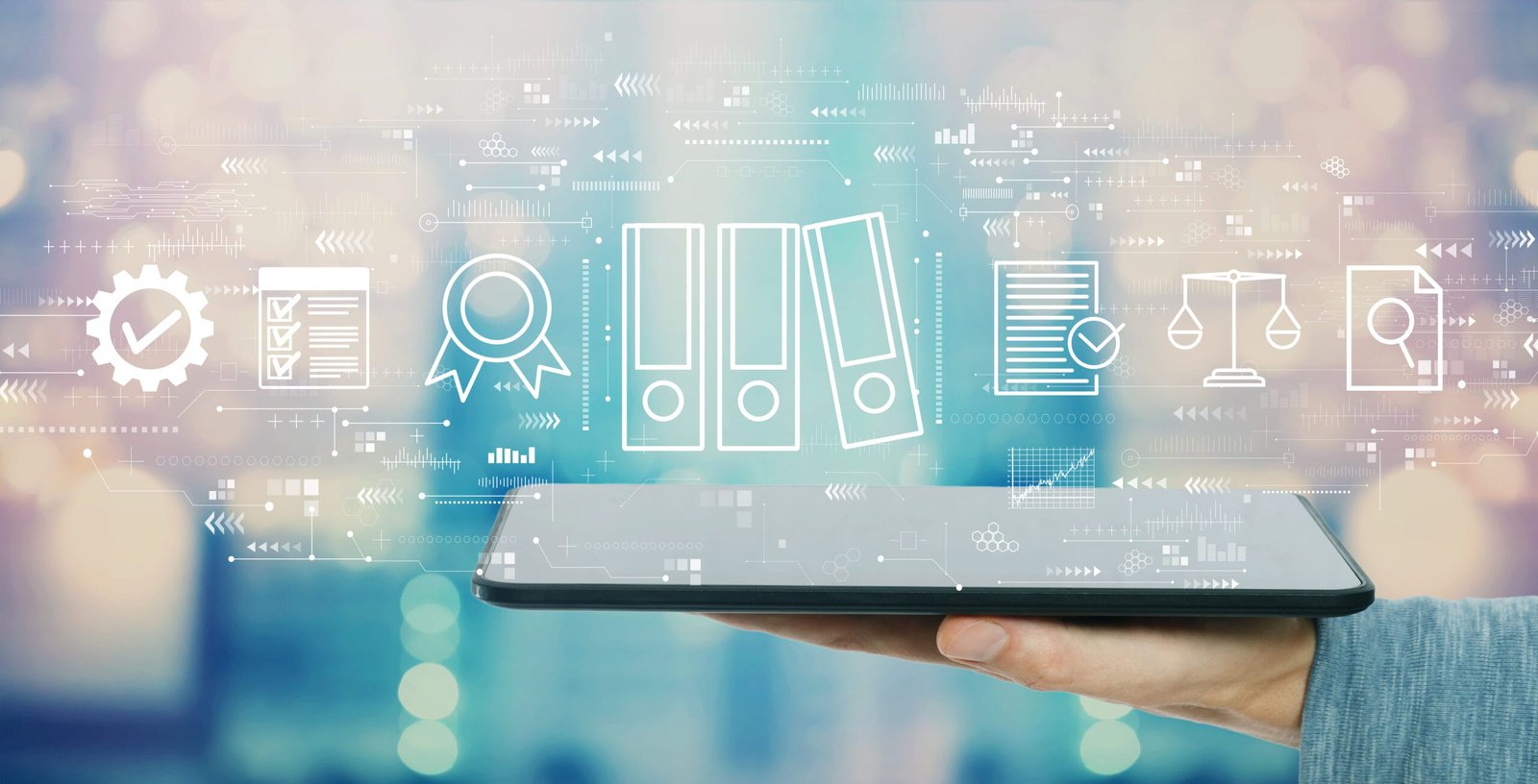 Person holding a tablet with compliance awards and checkmark icons above